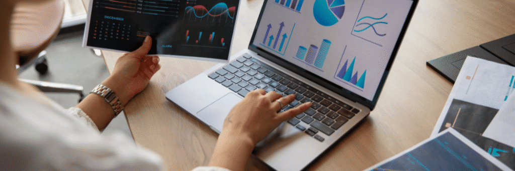 Kanerika blog banner for data migration testing showing analytics charts on a laptop and tablet.