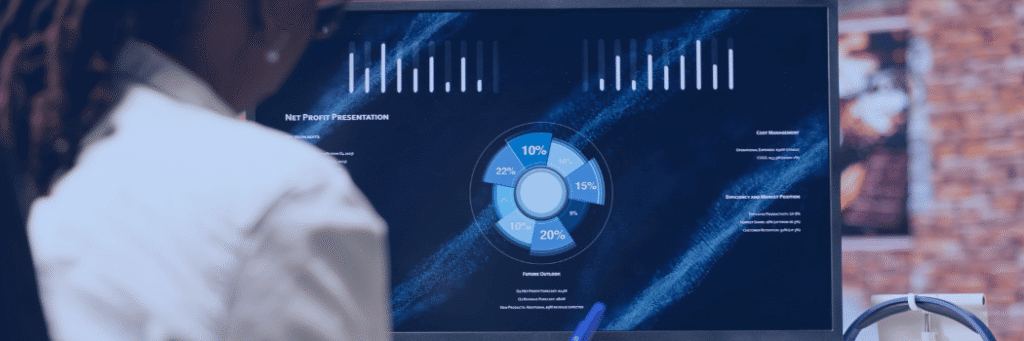 Kanerika blog banner for Snowflake Hybrid Tables showing business analytics charts on a presentation screen.