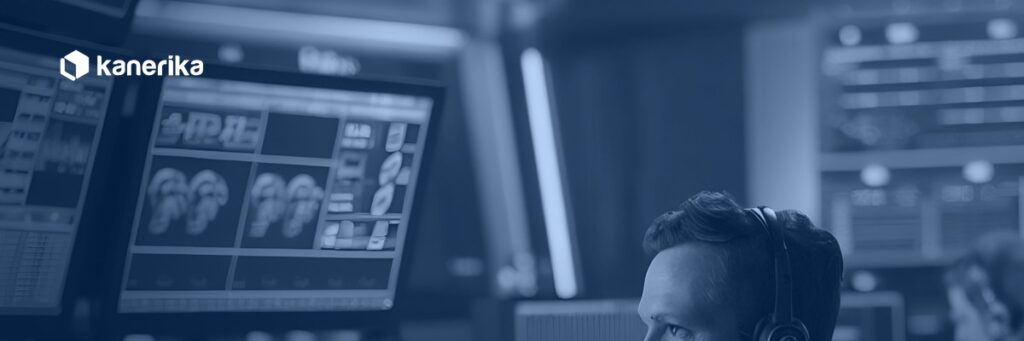 Operator monitoring pipelines in a control room, representing data warehouse automation