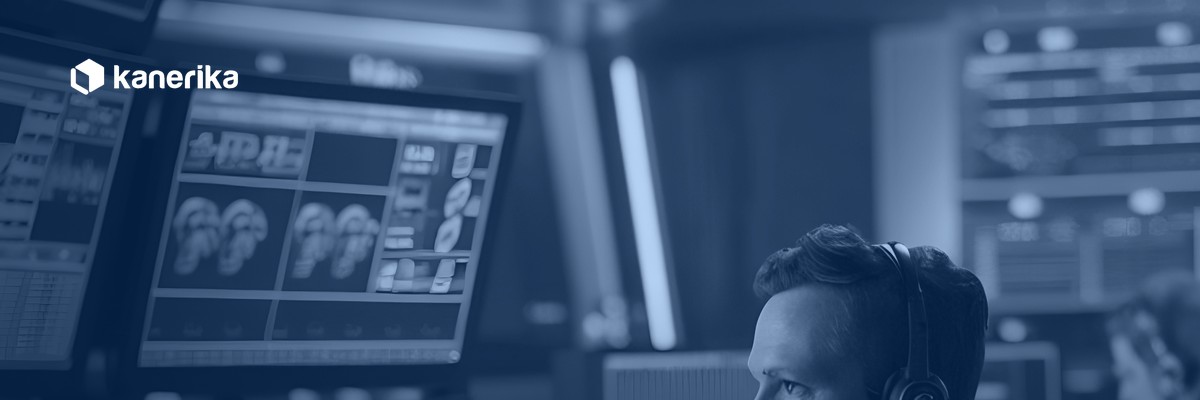 Operator monitoring pipelines in a control room, representing data warehouse automation