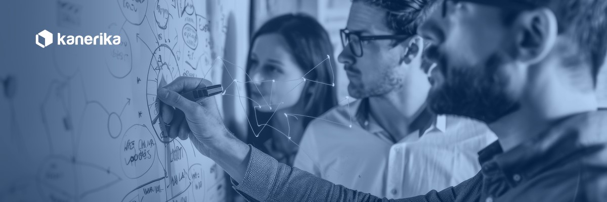 Engineering team mapping architecture on a whiteboard, representing Databricks Workflows orchestration