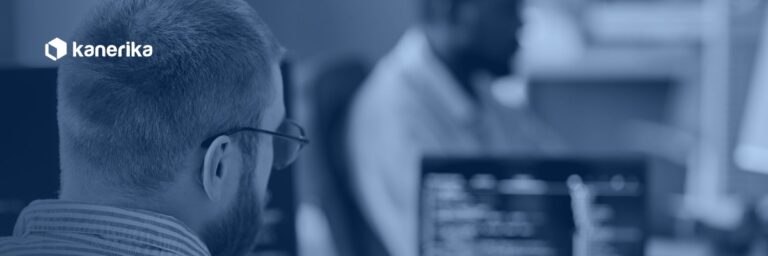 Developer writing database code at a workstation, representing Snowflake stored procedures and SQL scripting