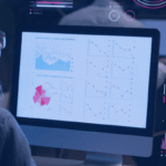 Kanerika vs Damco Solutions blog banner showing a data analyst reviewing business dashboards and performance reports.
