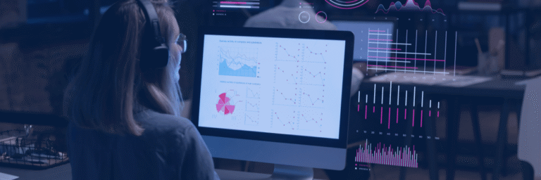 Kanerika vs Damco Solutions blog banner showing a data analyst reviewing business dashboards and performance reports.