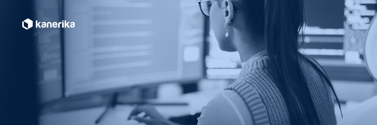 Kanerika banner for AI agent evaluation, an analyst reviewing code and test dashboards on screen