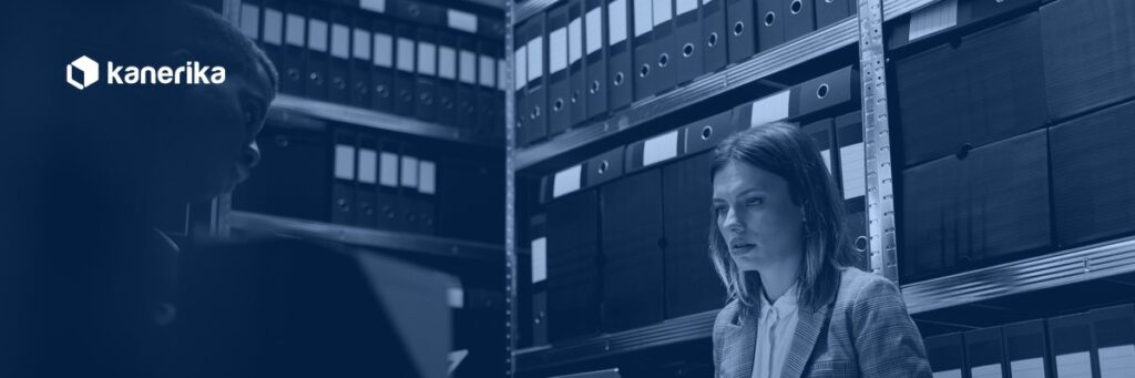 Team searching binders and files in an enterprise archive, the retrieval problem AI knowledge management solves