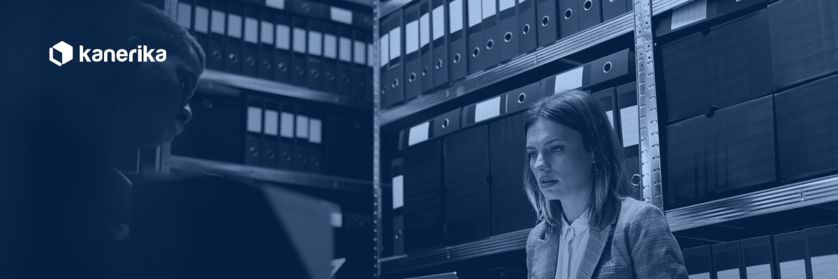 Team searching binders and files in an enterprise archive, the retrieval problem AI knowledge management solves
