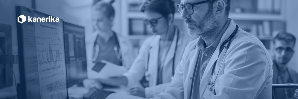 Healthcare IT team reviewing patient data systems, banner for custom healthcare software development guide