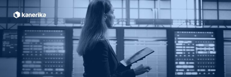 Data platform engineer reviewing server racks on a tablet, representing Databricks metastore governance across a cloud region