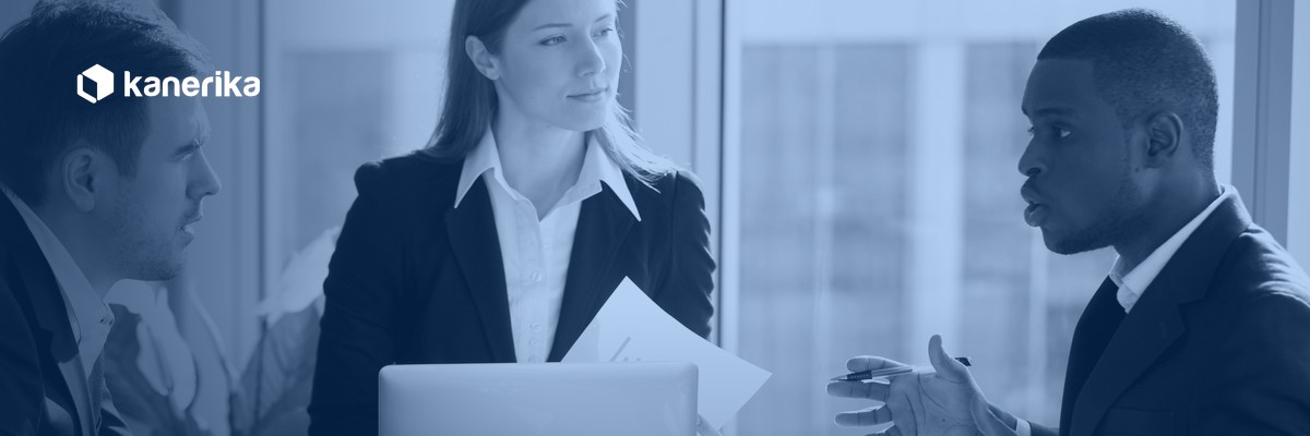 IT leaders weighing staff augmentation vs managed services in a boardroom partner discussion