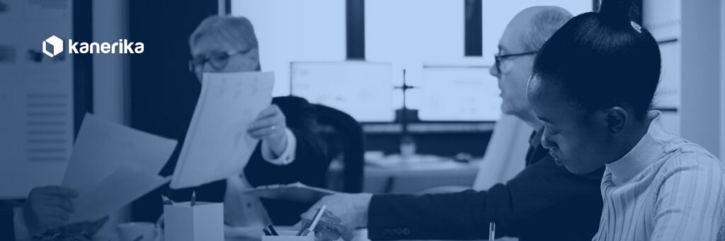 Engineering leaders reviewing engagement contracts while weighing staff augmentation vs outsourcing for their team