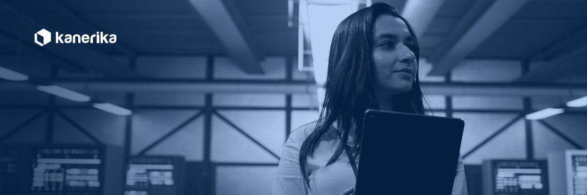 Kanerika banner for data access governance tools, a data center administrator reviewing security and access controls on a tablet