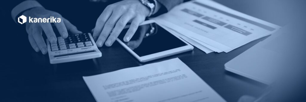 Microsoft Purview licensing cost analysis with a calculator, contract documents and a tablet on a desk, Kanerika blog banner