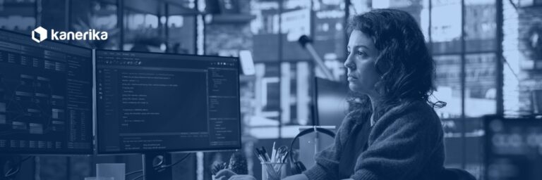 Software engineer working on agentic AI web development, an autonomous coding agent assisting with a web application build on a dual-monitor setup