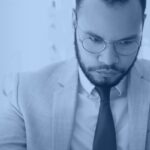 Businessman reviewing a contract document, representing AI contract policy compliance monitoring