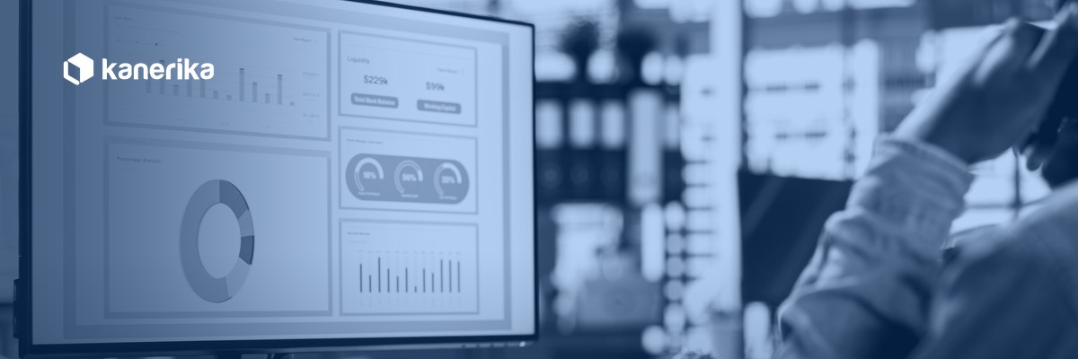 Kanerika AI data quality: business analyst reviewing analytics dashboards on screen