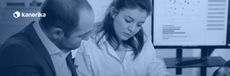 Two compliance professionals reviewing reports and a risk dashboard, illustrating AI governance risk and compliance oversight in an enterprise