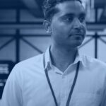 Data center engineer reviewing a cloud migration recovery plan, representing cloud migration best practices for enterprise teams