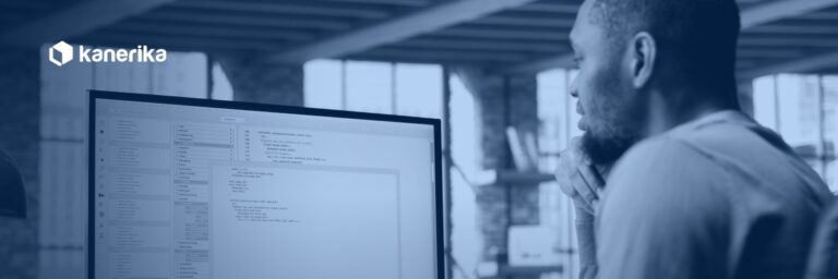 Data engineer reviewing SQL code on a monitor, illustrating a guide to the Databricks CREATE TABLE statement