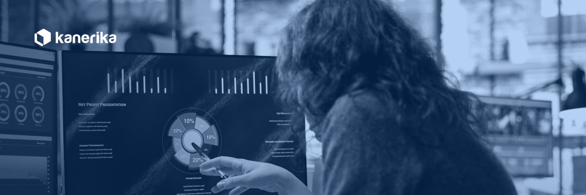 Data analyst reviewing a BI dashboard, hero banner for the Kanerika Databricks SQL warehouse guide