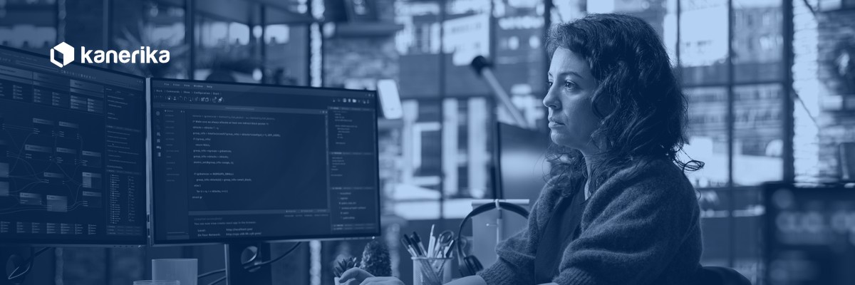 Full-stack developer building a full-stack development team, working across frontend and backend code at a multi-monitor workstation