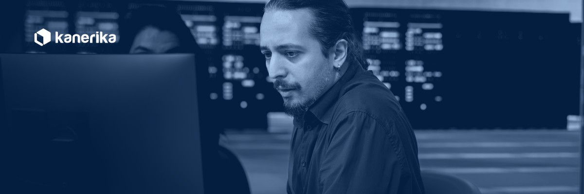 IT operations engineer reviewing generative AI incident alerts on monitoring dashboards in a data center