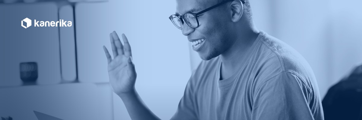 Remote software developer waving hello during a video call, representing how to hire remote developers for a distributed engineering team