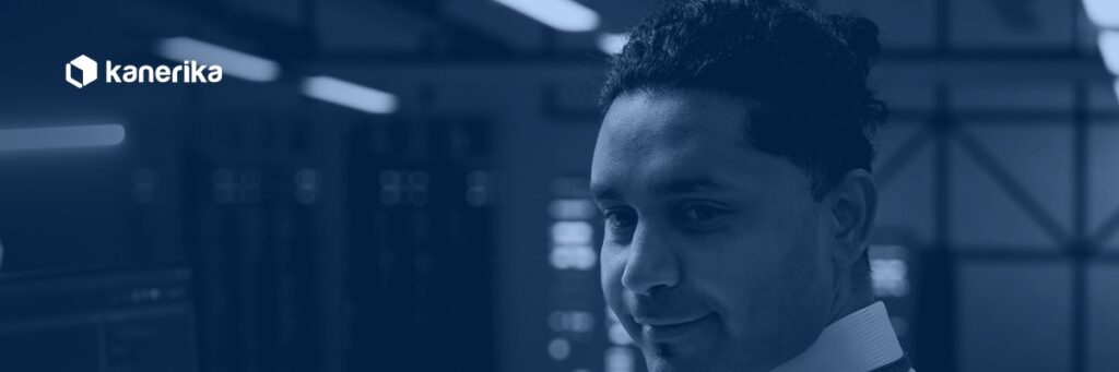 Kanerika legacy system modernization banner, IT technician in a data center server room