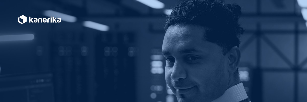 Kanerika legacy system modernization banner, IT technician in a data center server room