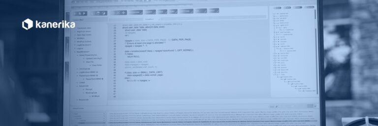 Kanerika banner for Snowflake CREATE TABLE guide, a coder writing SQL at a workstation with navy duotone treatment