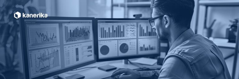 Data analyst reviewing multiple BI dashboards on dual monitors, representing a Snowflake semantic layer unifying metrics across tools