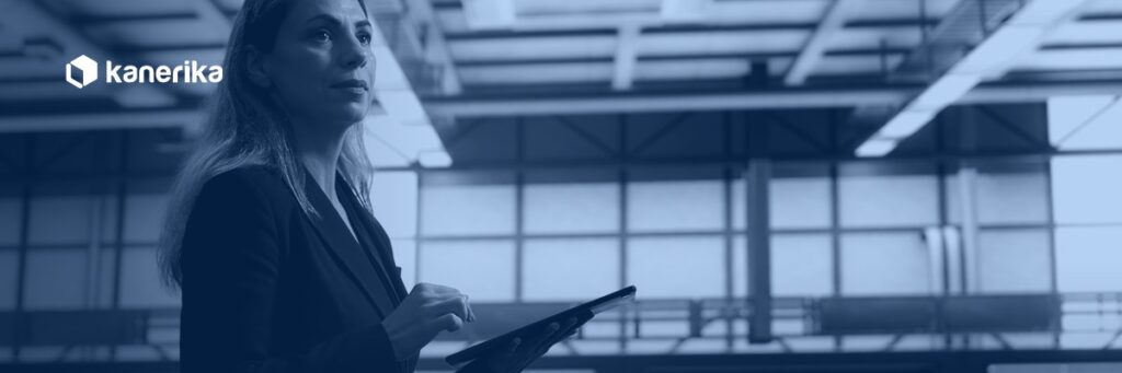 Data center engineer monitoring infrastructure, representing Snowflake temporary table session management, Kanerika blog banner