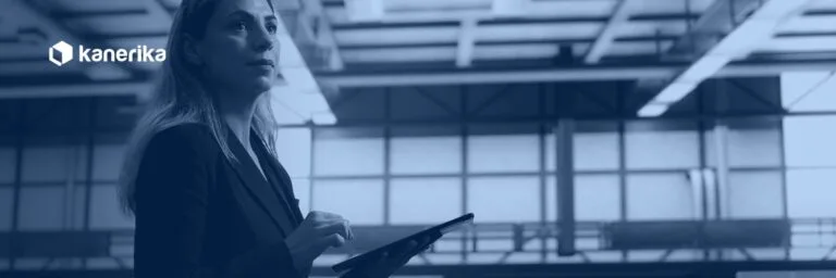 Data center engineer monitoring infrastructure, representing Snowflake temporary table session management, Kanerika blog banner