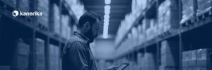 Warehouse manager reviewing supply chain data on a tablet, representing supply chain master data management