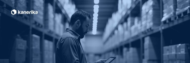 Warehouse manager reviewing supply chain data on a tablet, representing supply chain master data management