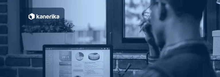 Business analyst reviewing an AI-powered business analytics dashboard on a laptop
