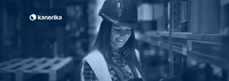 Warehouse worker with a tablet and barcode scanner checking inventory, illustrating AI in warehouse management