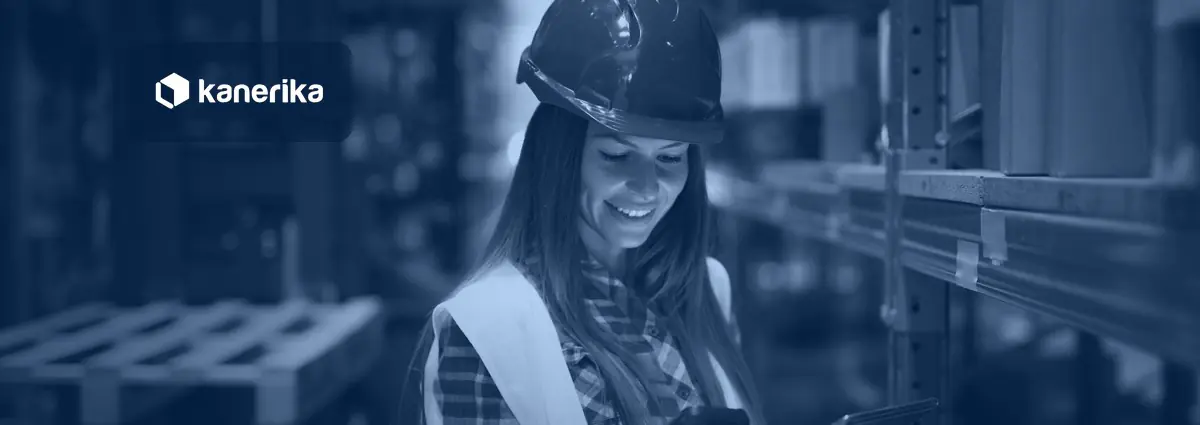 Warehouse worker with a tablet and barcode scanner checking inventory, illustrating AI in warehouse management