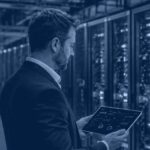 Kanerika banner for AI workload infrastructure: a data infrastructure architect reviewing GPU cluster utilization in a modern enterprise data center