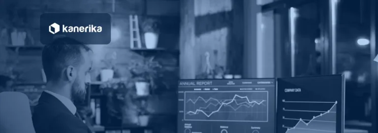 Analyst reviewing report charts on two monitors, illustrating custom data labels in Power BI report design