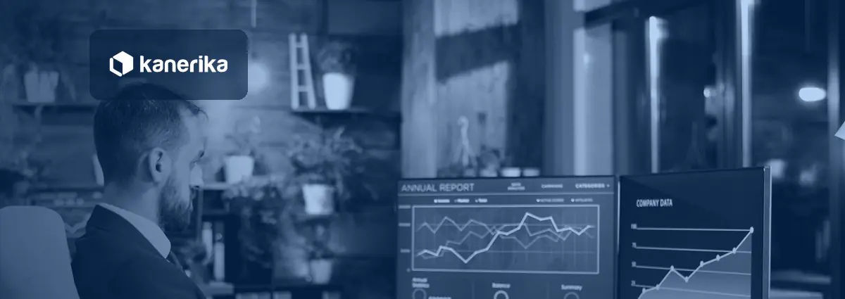 Analyst reviewing report charts on two monitors, illustrating custom data labels in Power BI report design
