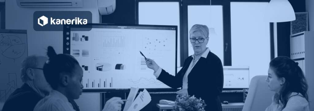 Data analytics tools banner showing an analyst presenting business intelligence dashboards to a team