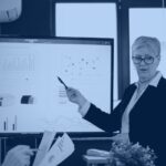 Analyst presenting one consolidated dashboard to a team, illustrating data consolidation into a single governed source