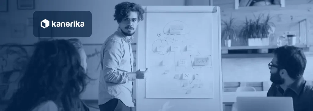 Product team planning a digital product roadmap at a whiteboard, representing digital product engineering