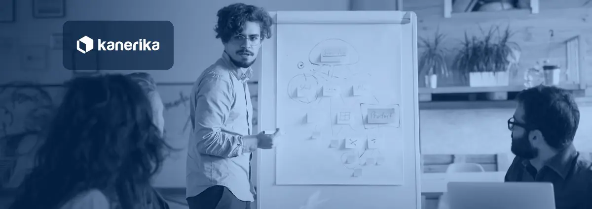 Product team planning a digital product roadmap at a whiteboard, representing digital product engineering