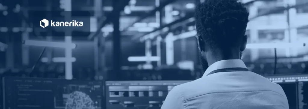 Engineer reviewing AI model architecture on monitors in a data center, header image for the enterprise AI architecture guide
