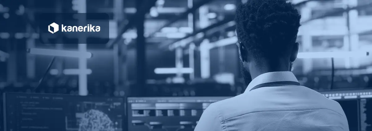 Engineer reviewing AI model architecture on monitors in a data center, header image for the enterprise AI architecture guide