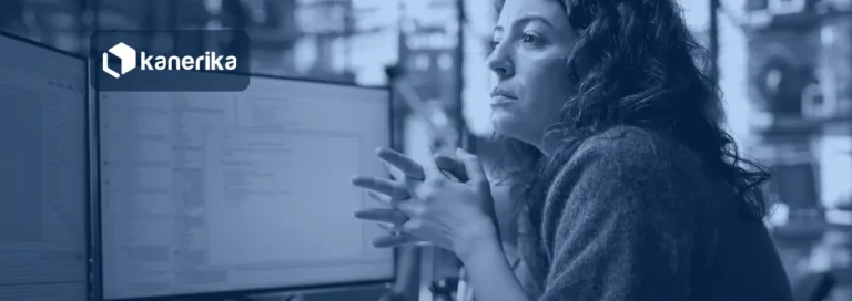 Software engineer reviewing code on a monitor, illustrating Jev AI use cases for enterprise decision automation