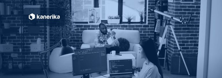Software engineer working on Keras and TensorFlow deep learning code on dual monitors, Kanerika