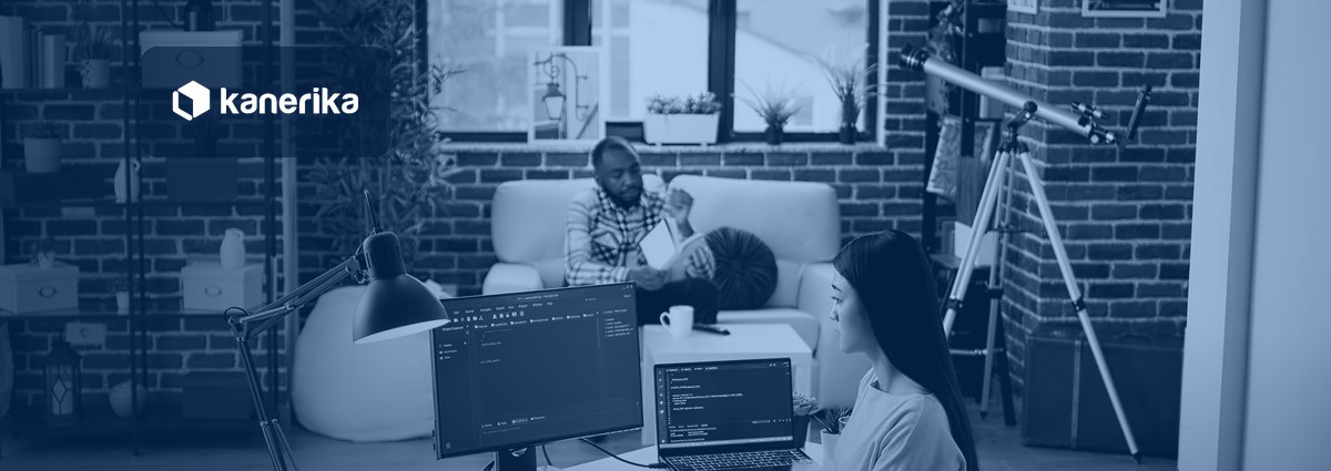 Software engineer working on Keras and TensorFlow deep learning code on dual monitors, Kanerika